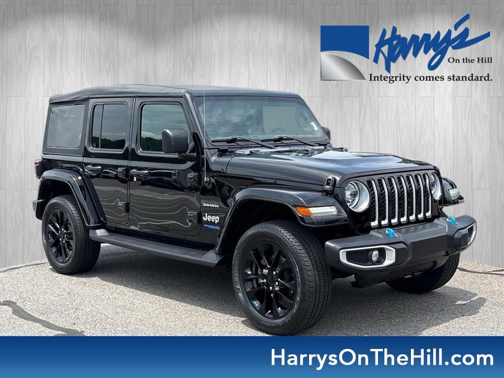2022 Jeep Wrangler 4xe Unlimited Sahara 4x4 in Black — front three-quarter view