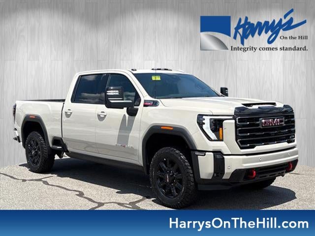 2026 GMC Sierra 2500 HD AT4 in Coastal Dune — front three-quarter view